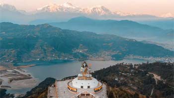 Sacred Pumdikot Shiva Temple surrounded by lush hills and Himalayan views